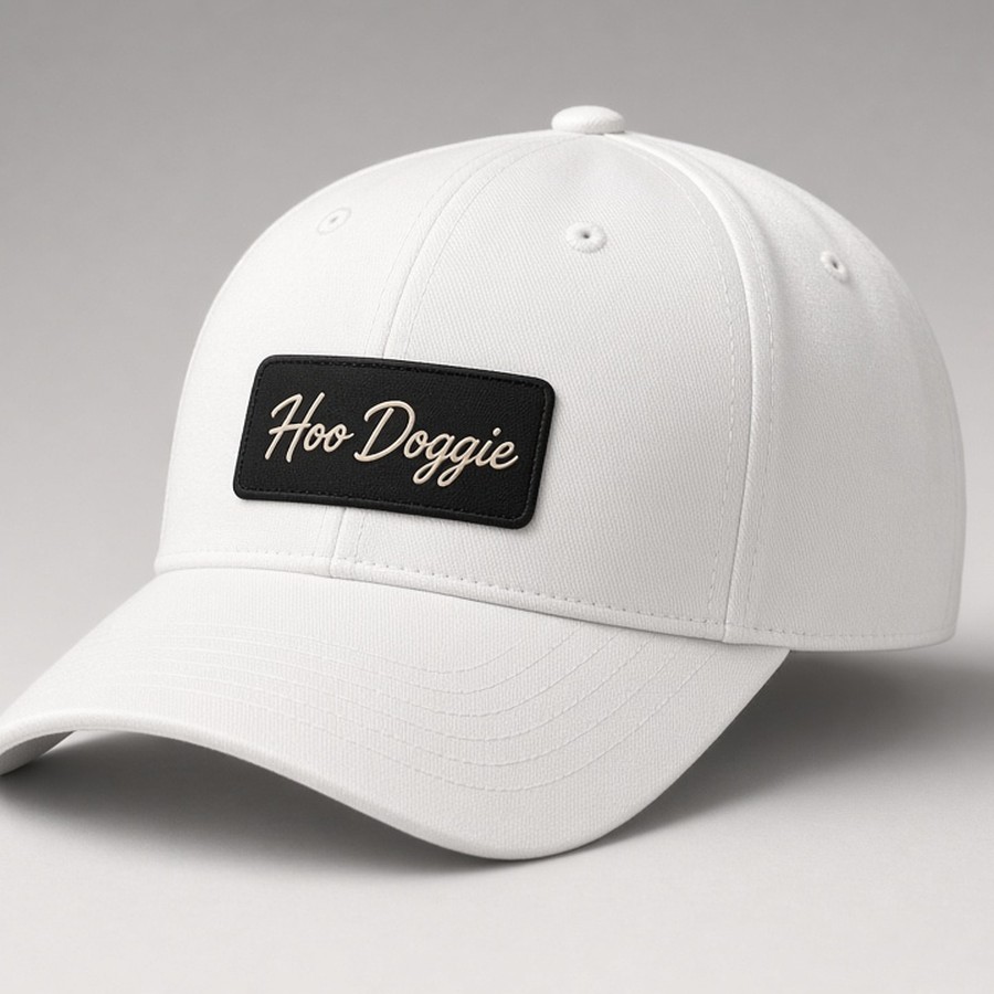 White cap with small black Hoo Doggie script patch, no rope