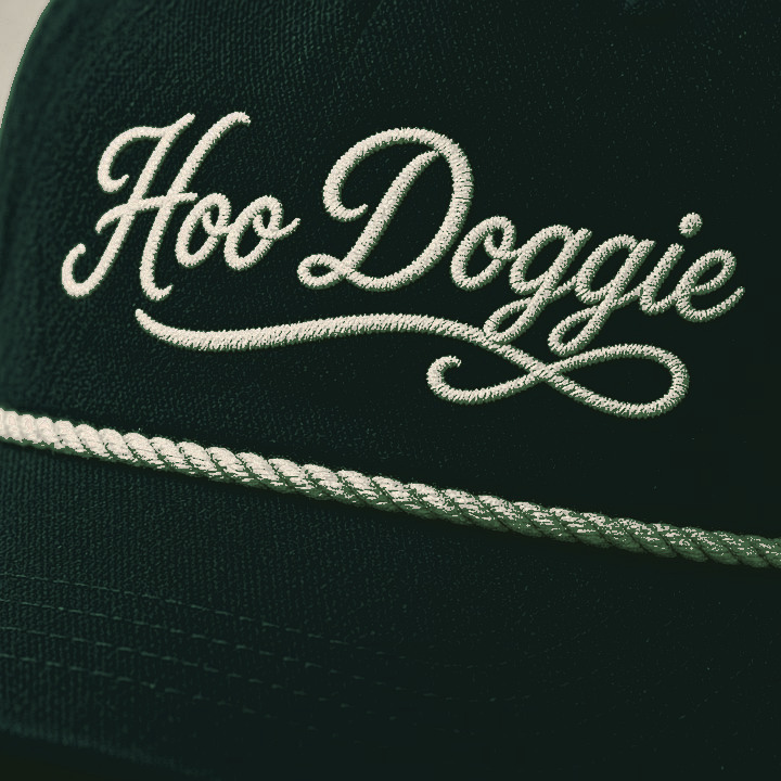 Forest green rope cap with cream Hoo Doggie script