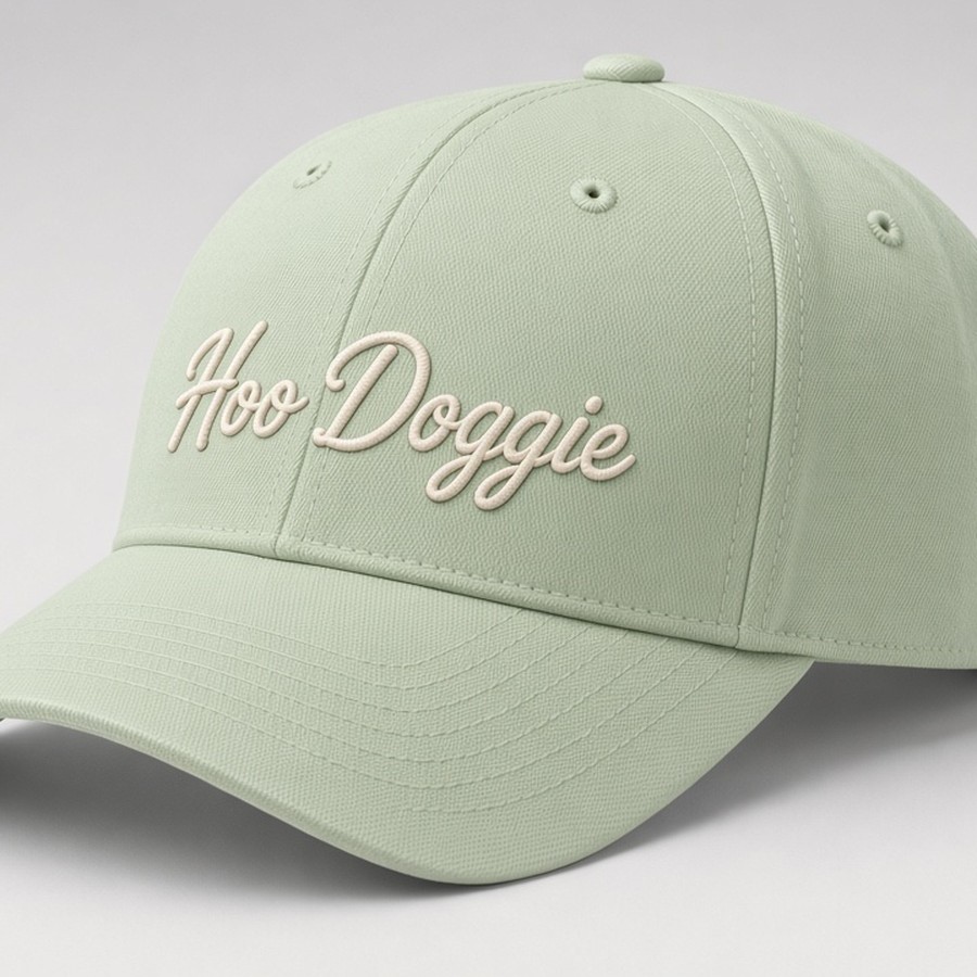 Light green cap with large cream Hoo Doggie script embroidery, no rope